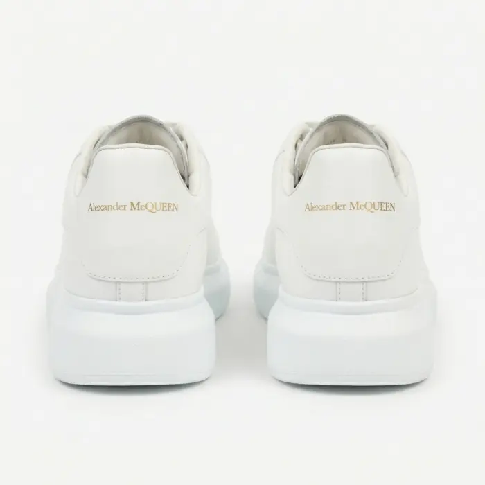 Alexander McQueen Oversized White sneakers back view showing gold logo on heel – SHUZAR Egypt