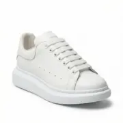 Alexander McQueen Oversized White sneaker front side view on white background – SHUZAR Egypt