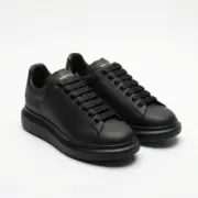 Alexander McQueen Oversized Black Sneakers Front View Pair - SHUZAR Egypt