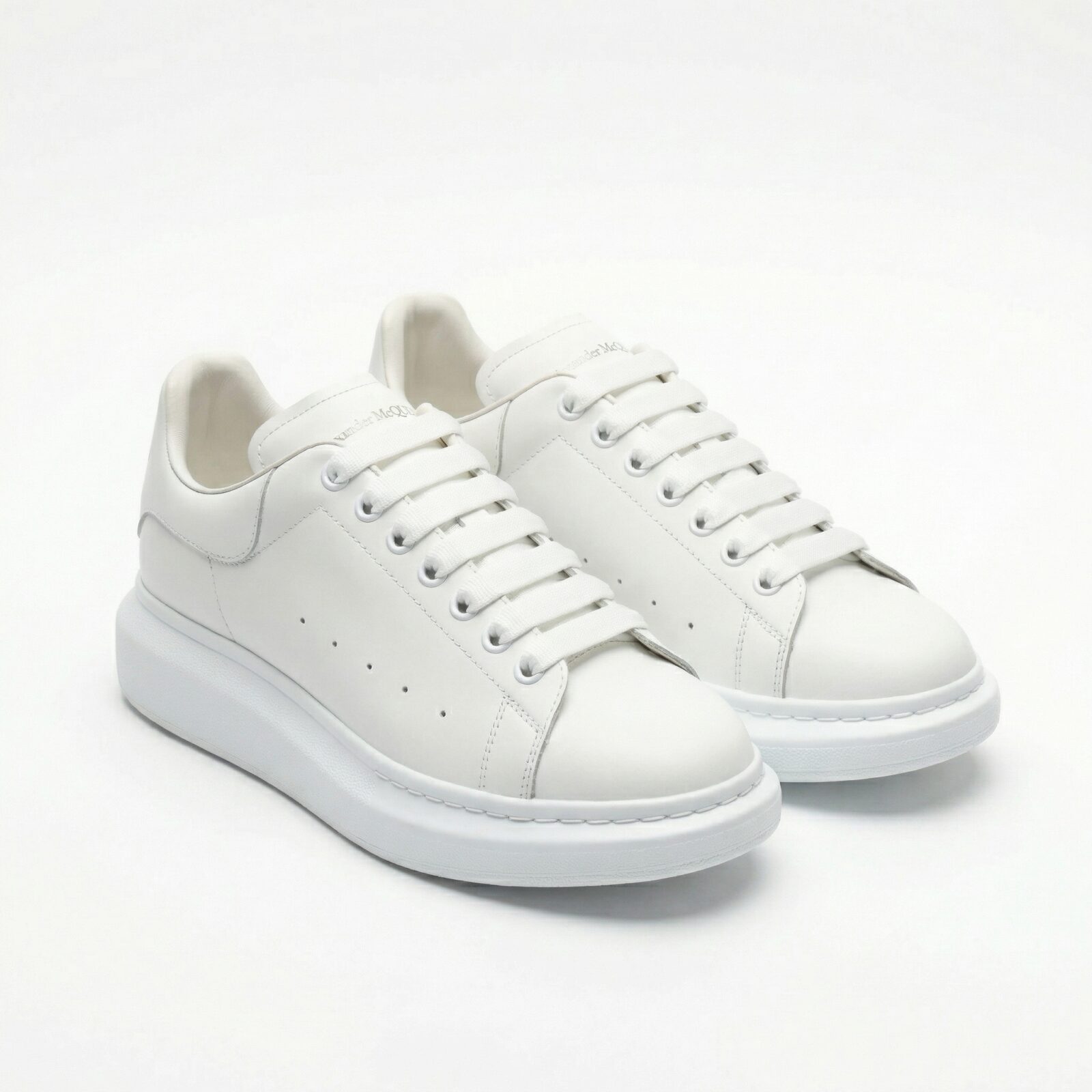 Alexander McQueen Oversized White sneakers front view pair on white background – SHUZAR Egypt