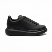 Alexander McQueen Oversized Black Sneakers Side View - SHUZAR Egypt
